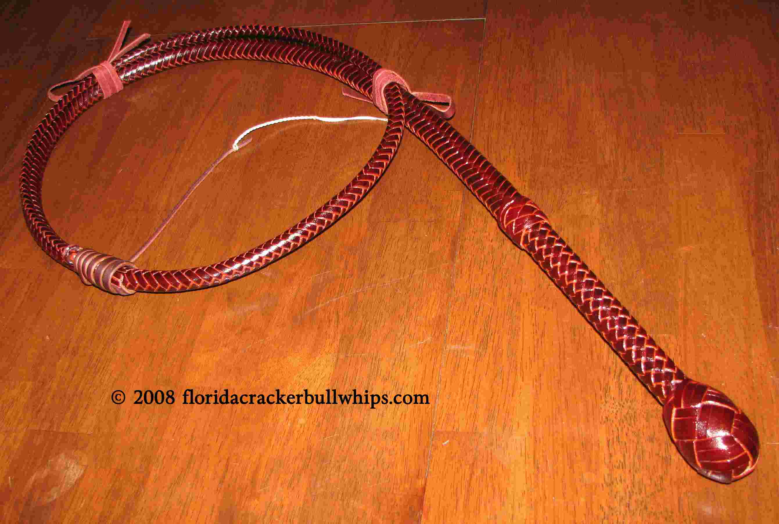 8 Foot 12 plait latigo cow hide bullwhip with 10" handle.